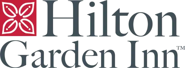 Hilton Garden Inn logo featuring a red square with a white floral design next to the text "Hilton Garden Inn" in grey lettering.