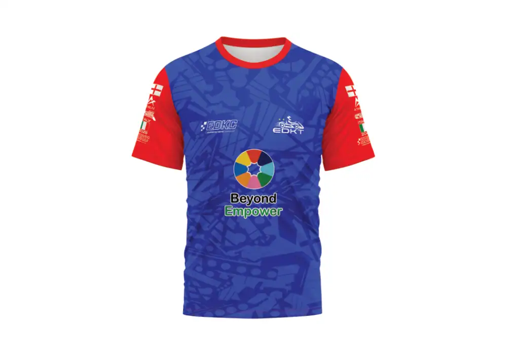 A short-sleeve sports shirt with red sleeves and a blue body featuring abstract patterns, logos, and the text "Beyond Empower" on the front.